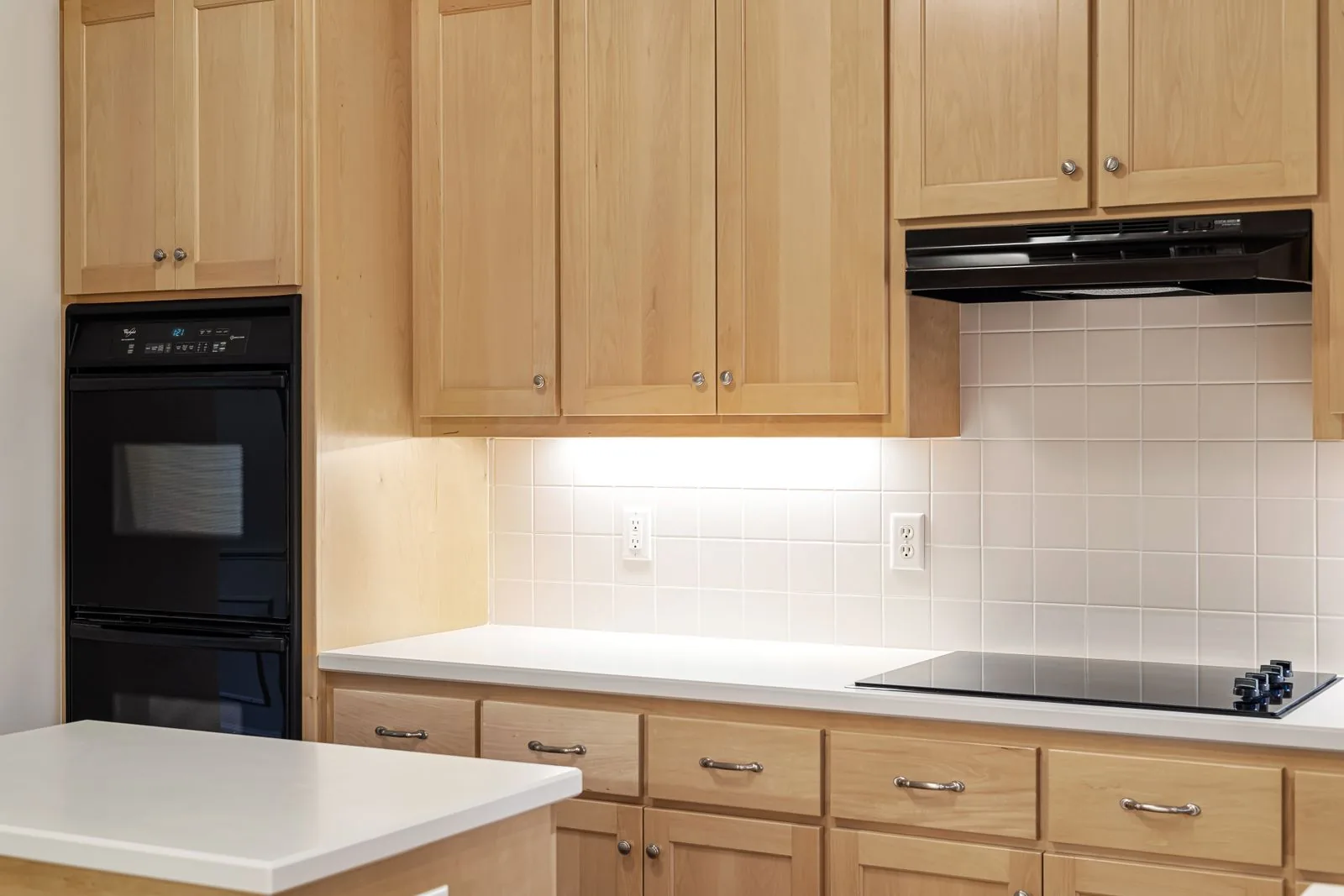 A kitchen of wooden cabinet doors around a built-in oven — cabinet door replacement in Murfreesboro, TN
